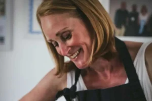 Claire Burt making artisan cheese at Burts Cheese, featured on the Taste of Chester Food Tours.