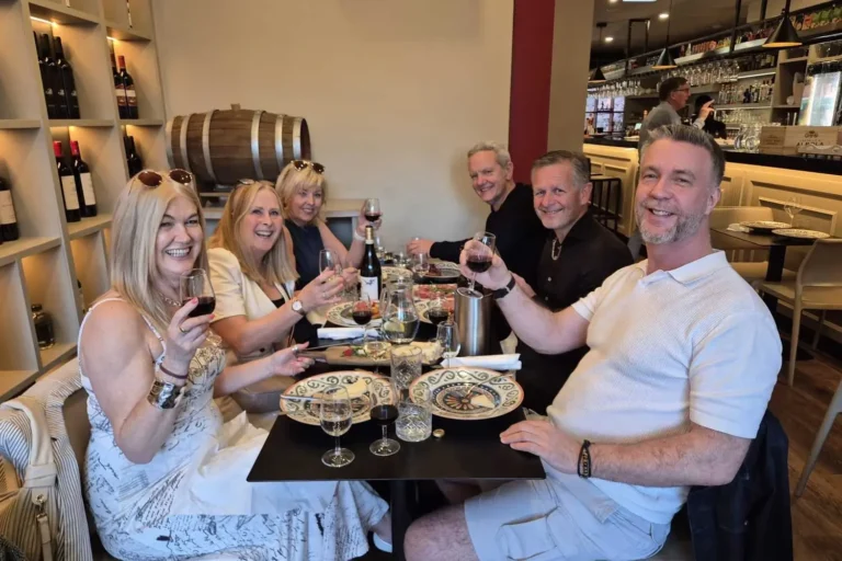 Group of people enjoying a wine tasting during the Liverpool Wine Tour experience