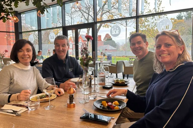 wrexham-food-tour-guests-enjoying-local-dishes Four guests enjoying local food on the Croeso to Wrexham food tour